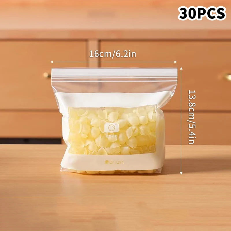 Clear plastic bag with food contents on a wooden surface, showing dimensions.