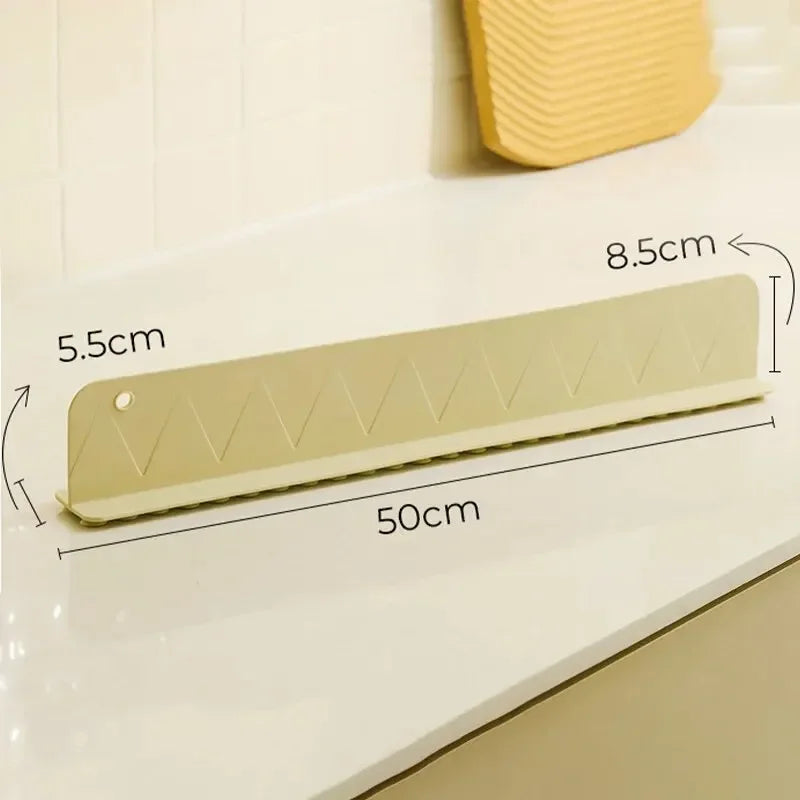Beige kitchen scrubber with dimensions labeled on a white surface