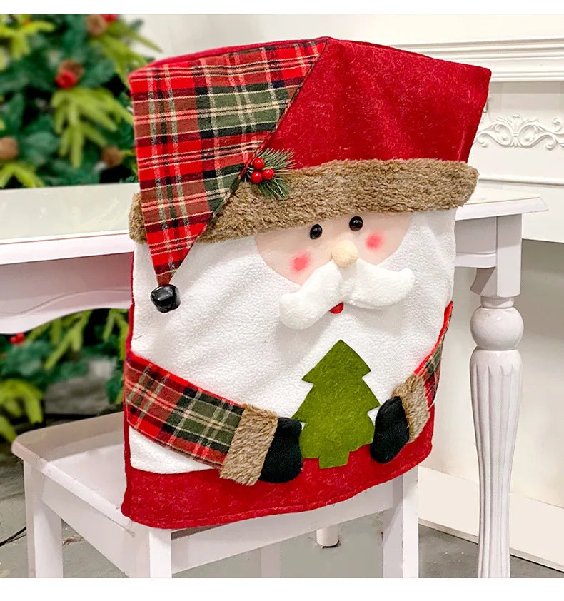 Santa Claus chair cover on a white chair with a Christmas tree in the background