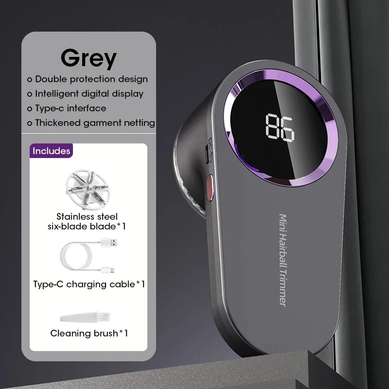 Gray mini hairball trimmer with digital display and included accessories on a dark background