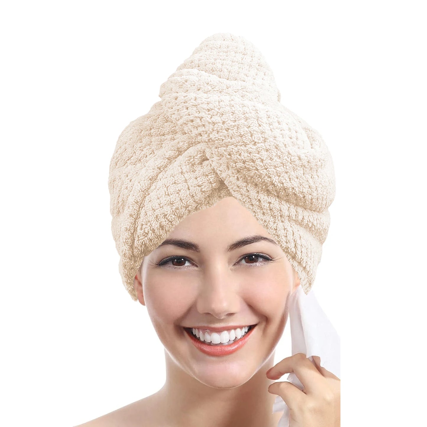 Woman wearing a beige hair turban on a white background