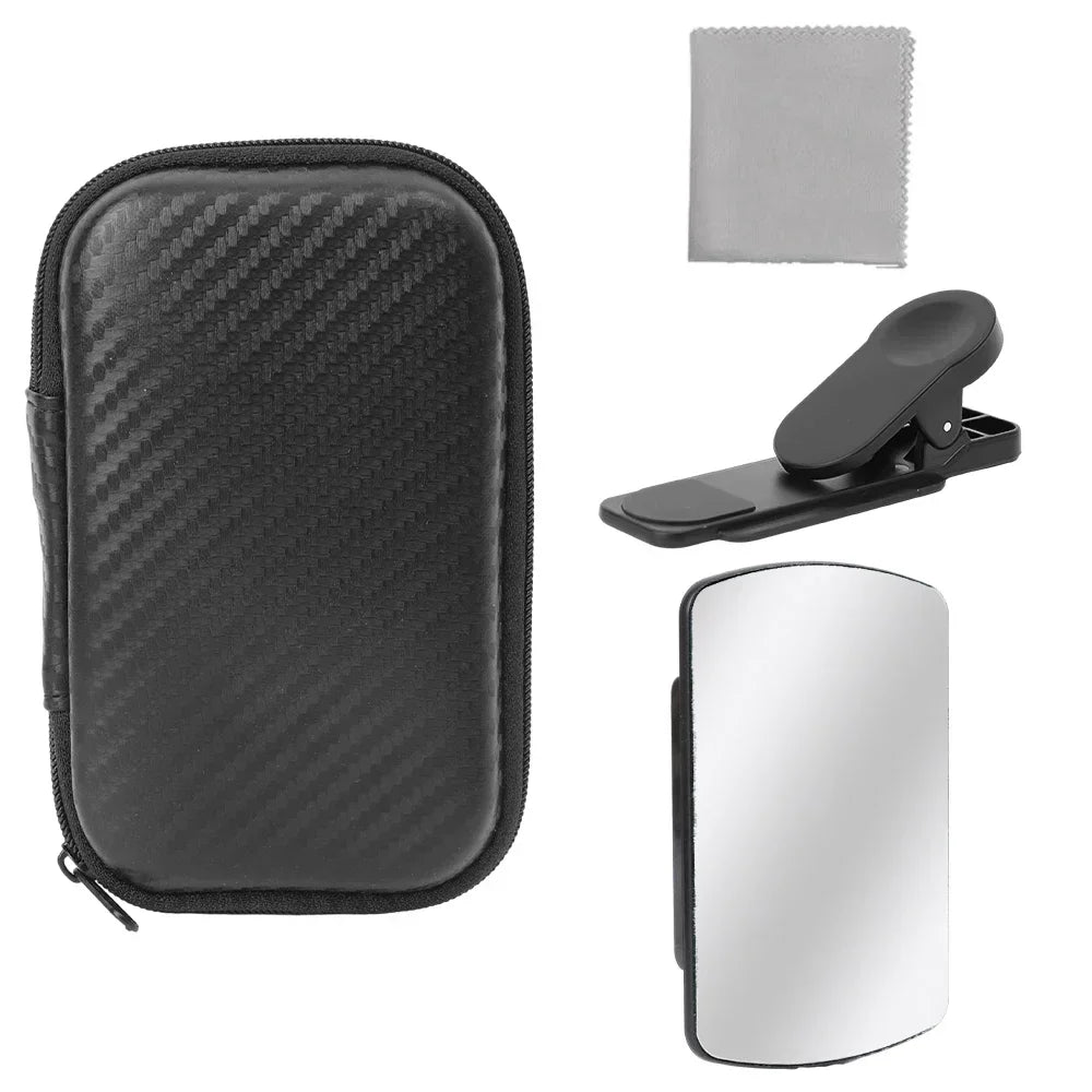 Camera cleaning kit with black case, mirror, and clip on a white background