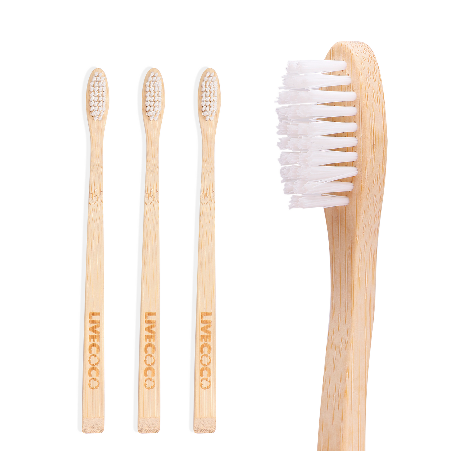 Set of four bamboo toothbrushes with white bristles on a white background