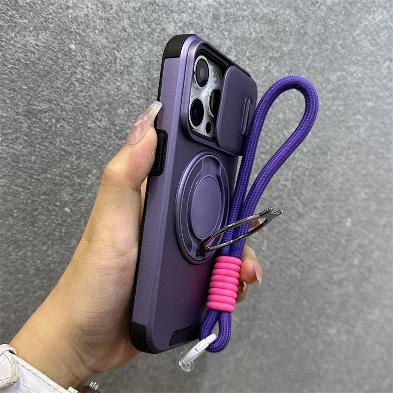 Purple phone case with a pink lanyard held by a hand against a gray background