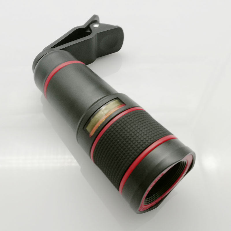 Black and red phone camera lens on a white background