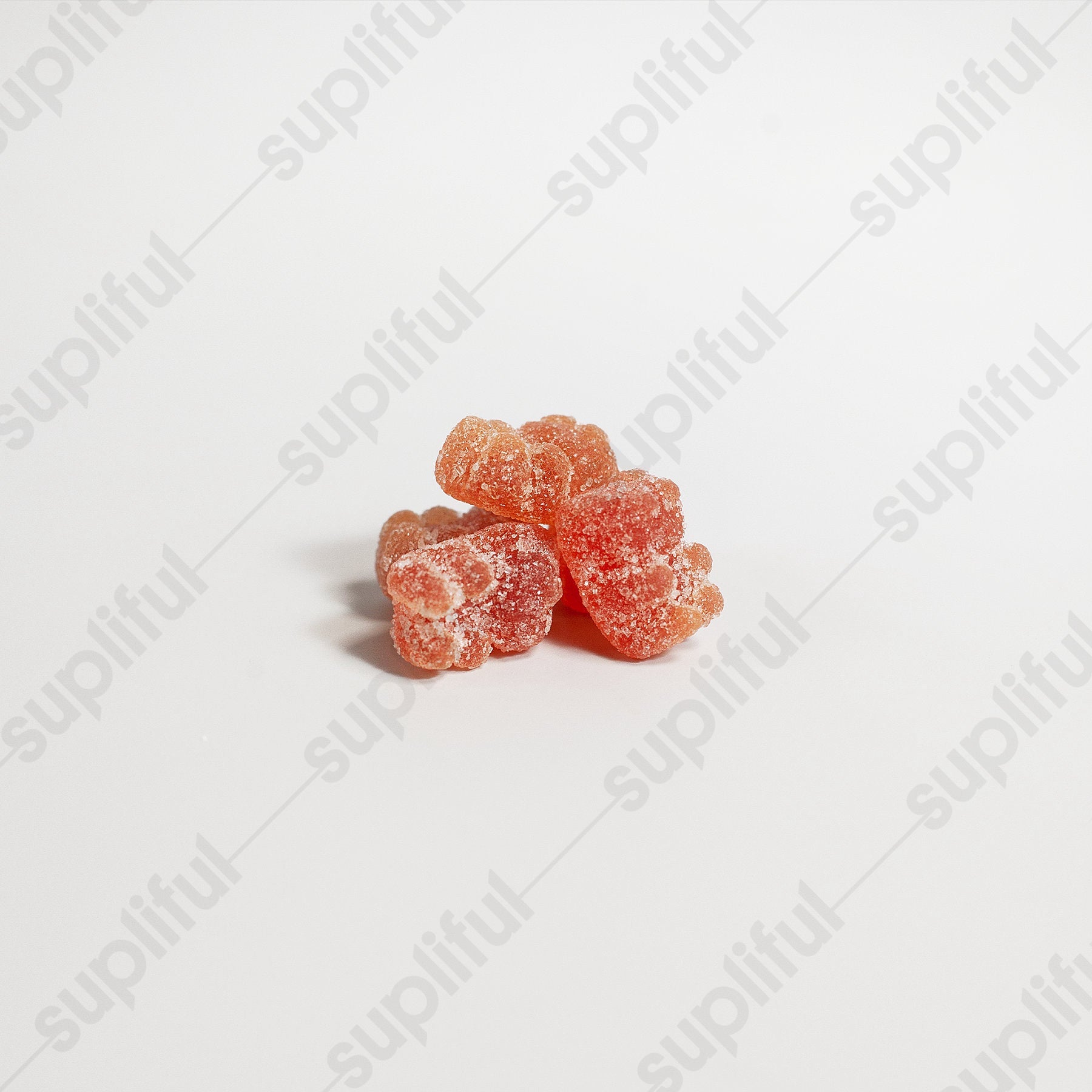 Cluster of pink gummy candies on a white background with 'suplifull' branding.