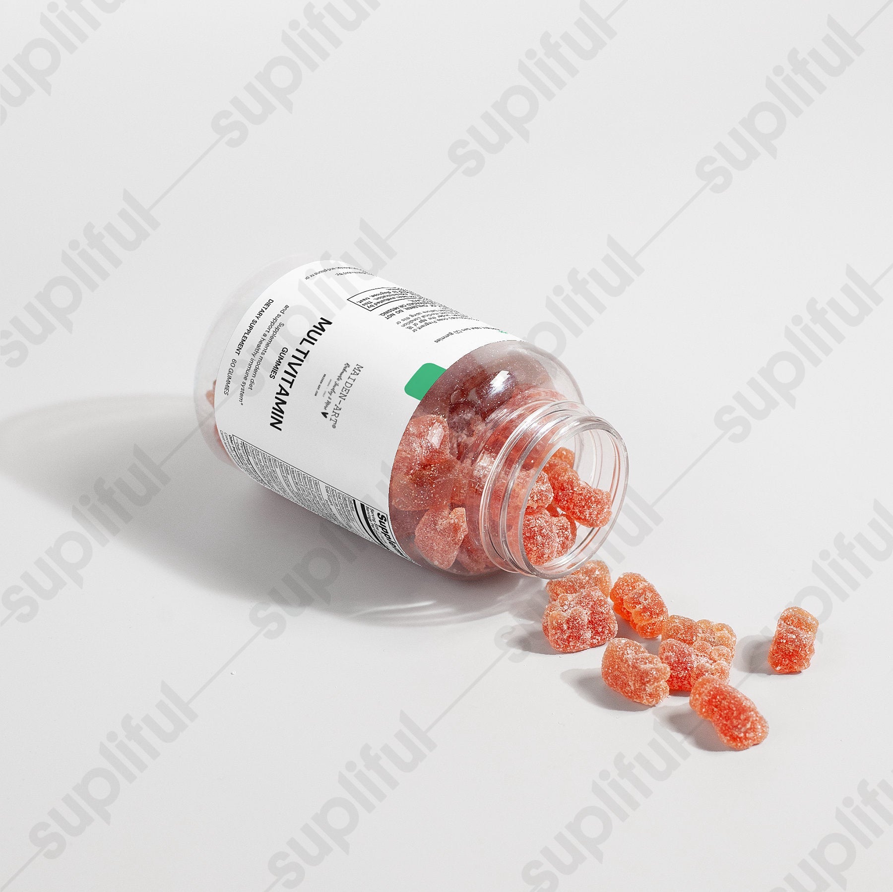 Jar of gummy vitamins with scattered gummies on a light gray background