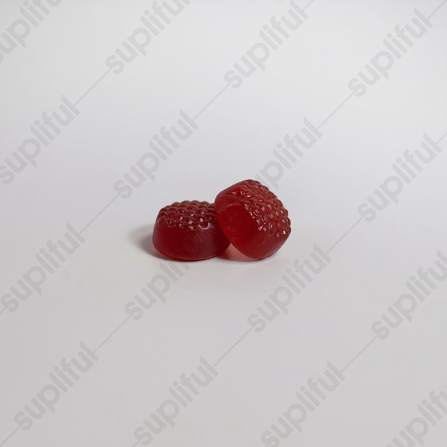 Two red gummy candies on a white background with 'suplifull' branding.