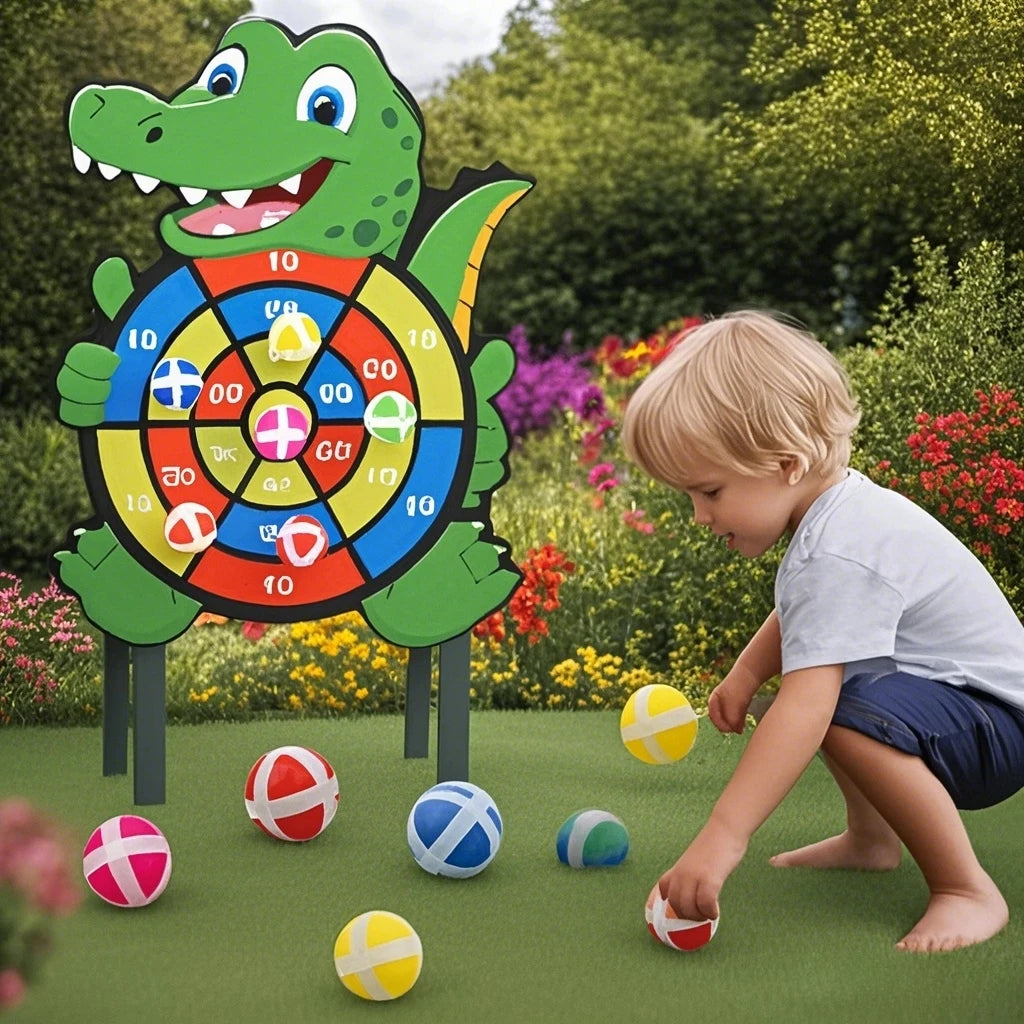 Child playing with a colorful dartboard shaped like a crocodile in a garden.