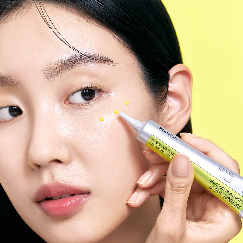 Person applying a cosmetic product to their face with a yellow background