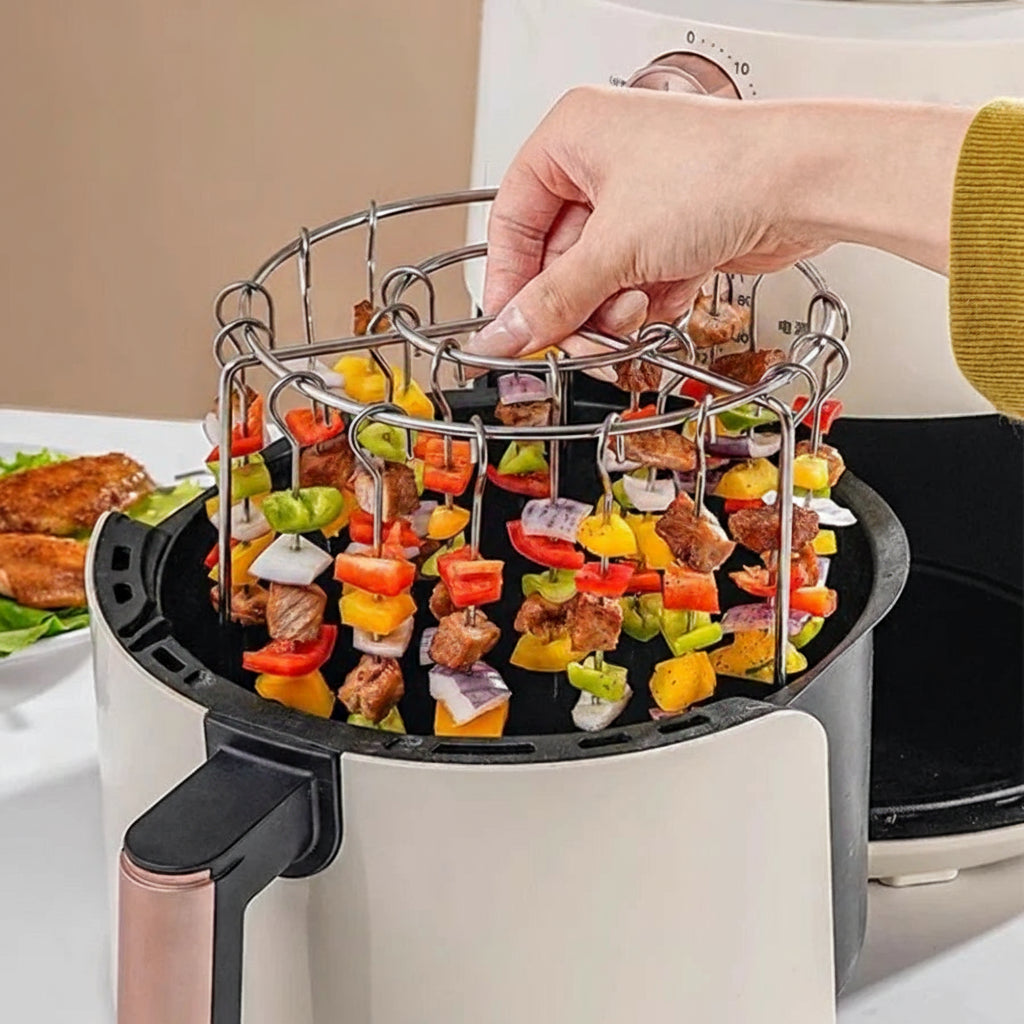 Special grill for air fryer with skewers of vegetables and meat being placed into an air fryer.