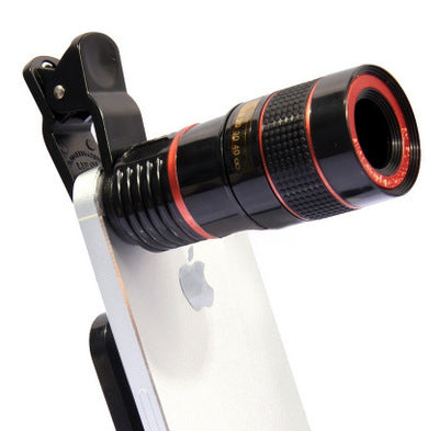 Phone with a black telescope lens attachment on a white background