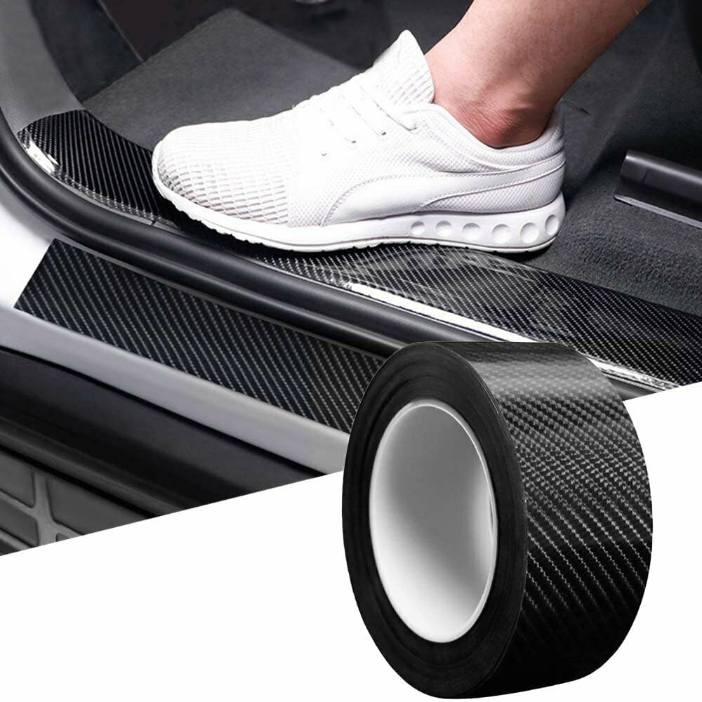 Person stepping onto a car door sill protector with a roll of the product in the foreground.