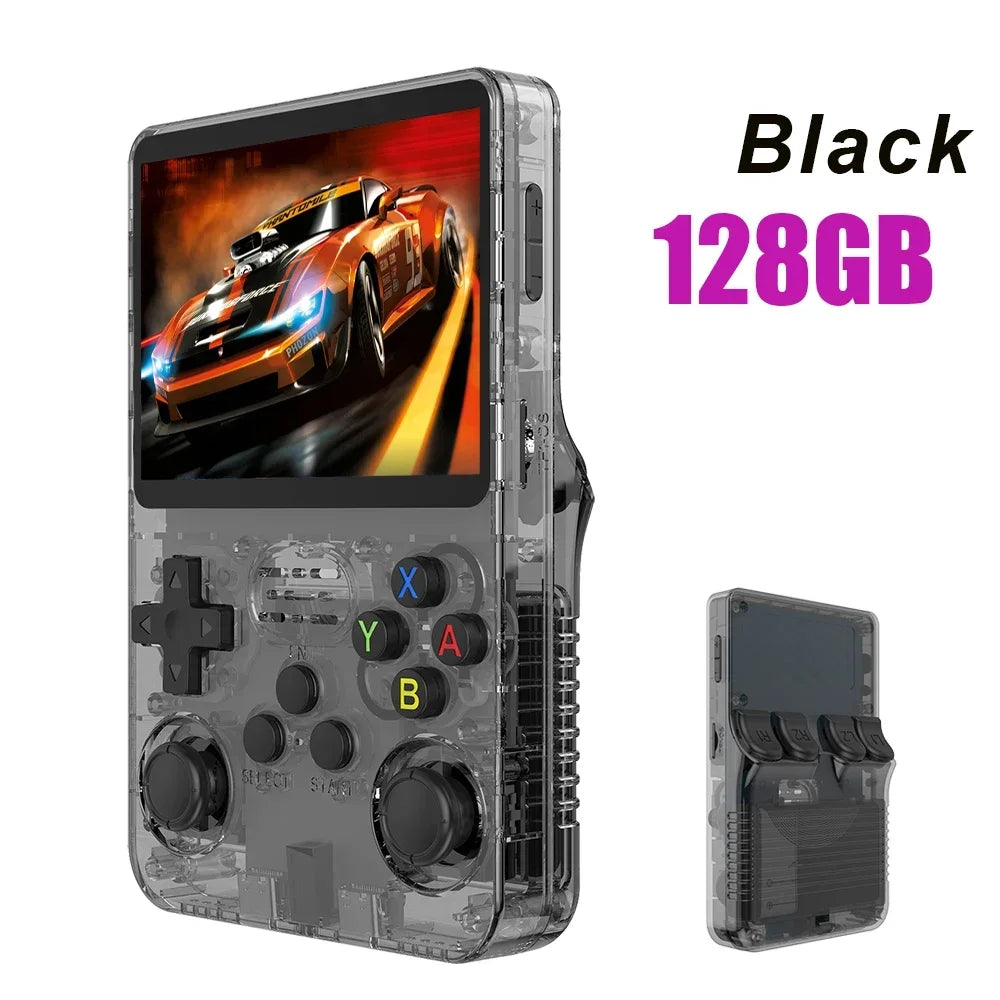 Handheld gaming console with transparent casing, black buttons, and screen displaying a racing game. 'Black 128GB' text is visible.