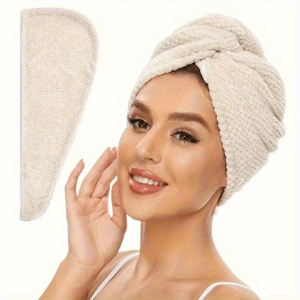 Woman wearing a beige hair towel on her head with a white background