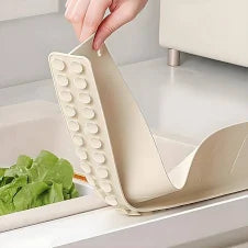 Vegetable cleaner with lettuce on a kitchen counter