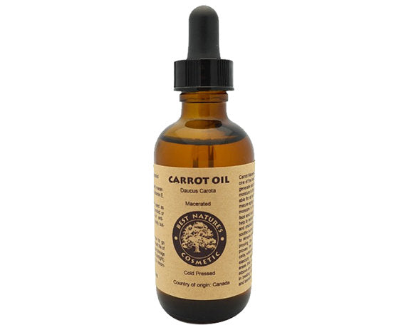 Bottle of carrot oil with a dropper on a white background