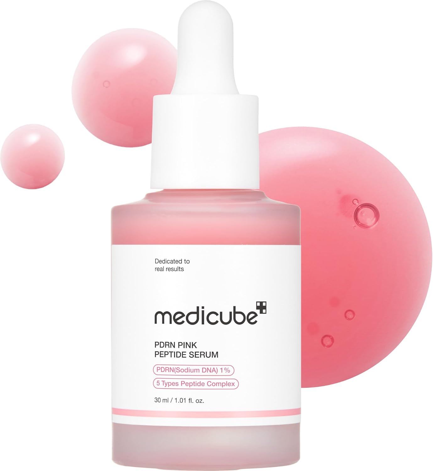 Pink skincare serum bottle with dropper labeled 'medicube' on a white background