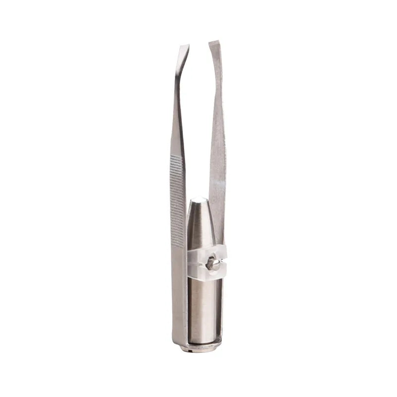 Metallic hair removal tool on a white background