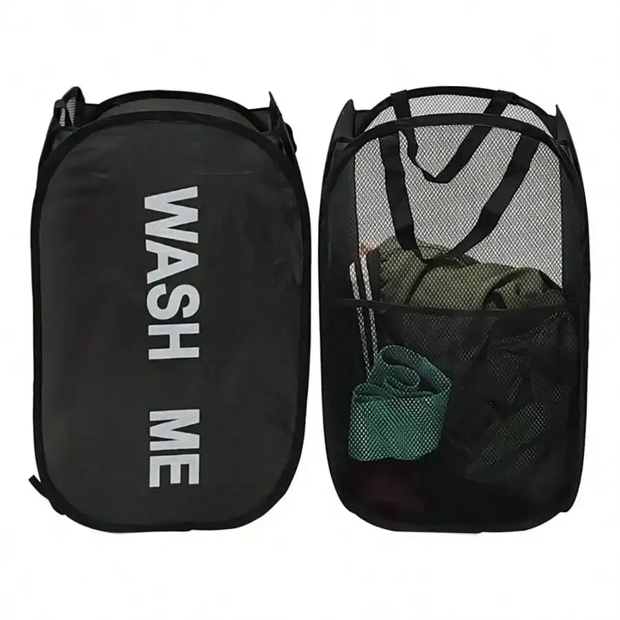 Black packing cube with 'WASH ME' text and mesh pocket showing green clothes inside.