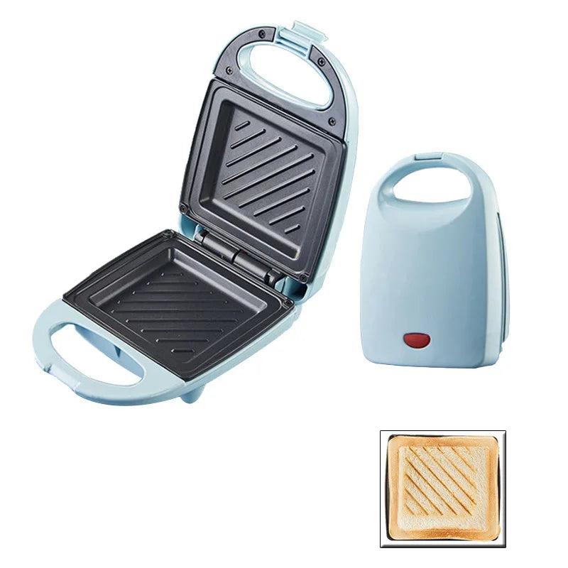 Compact grill with open lid showing grill surface, closed lid, and a small inset of toasted bread.