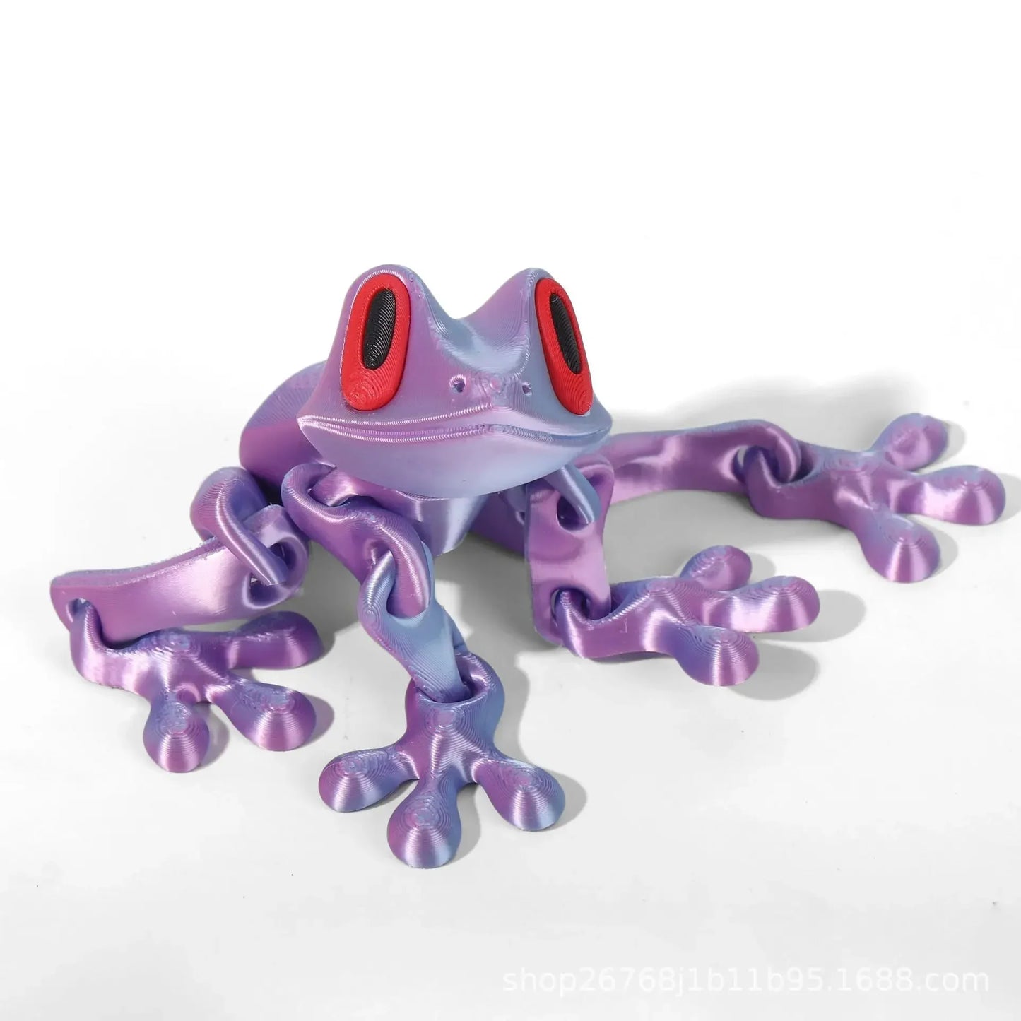 Purple and pink toy frog on a white background