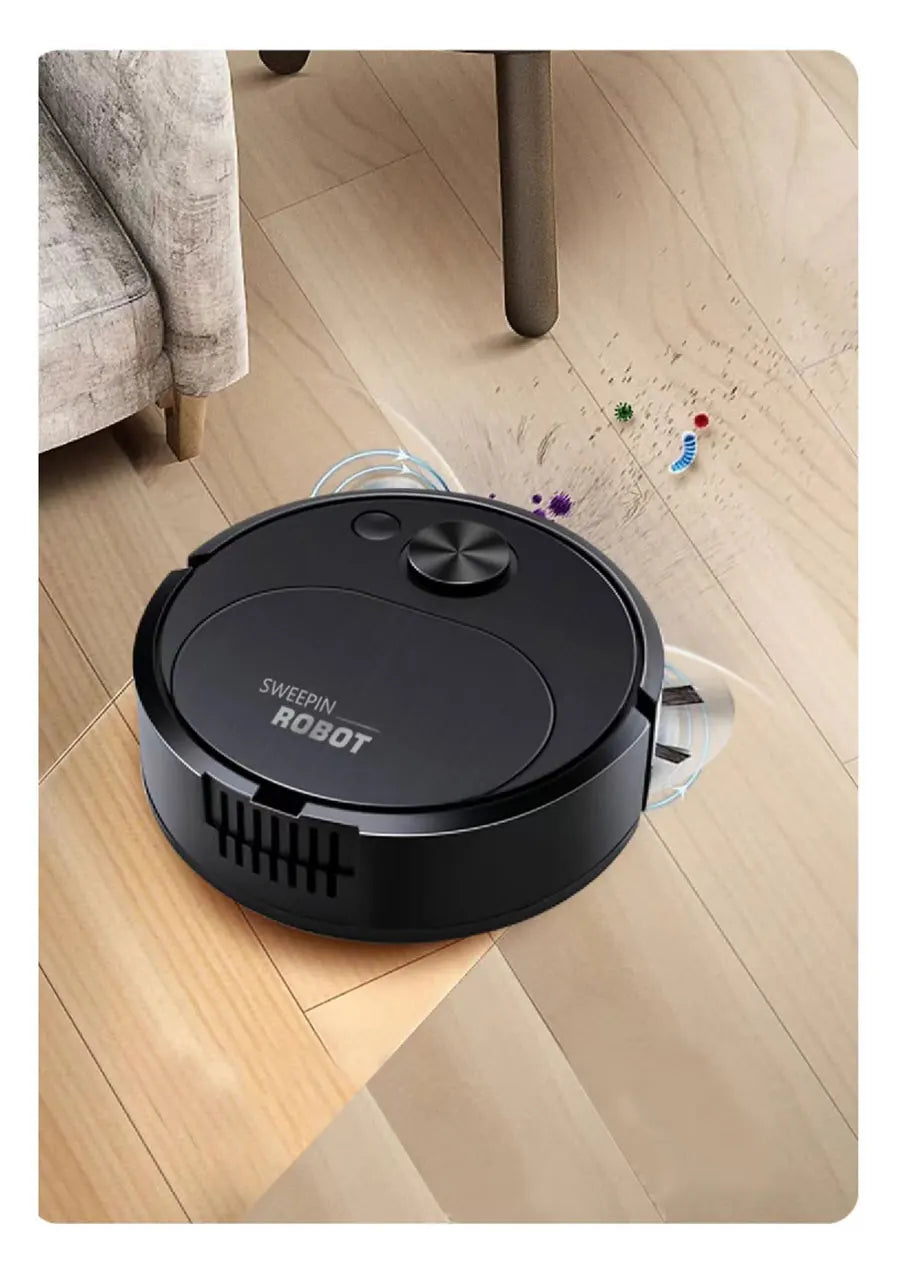 Black robot vacuum cleaner on a wooden floor with colorful toys scattered around