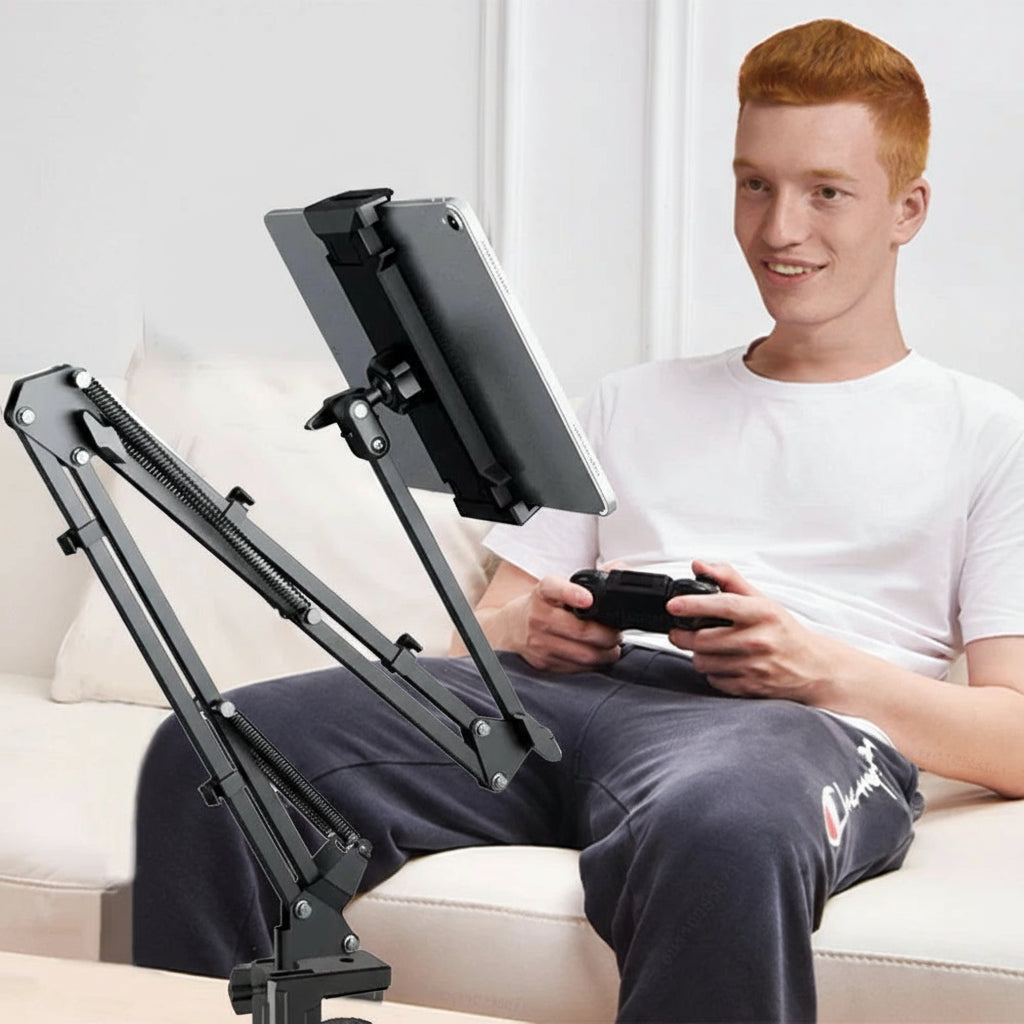 Person using a flexible stand arm to hold a tablet while sitting on a couch.