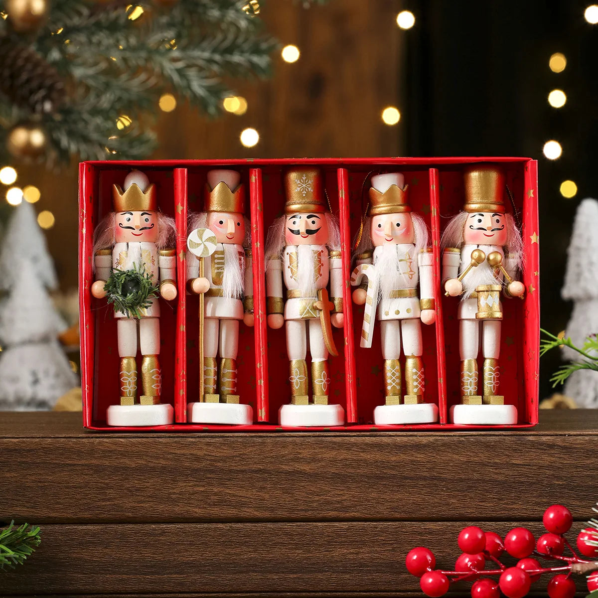 Set of five nutcrackers in a red box with Christmas decorations in the background