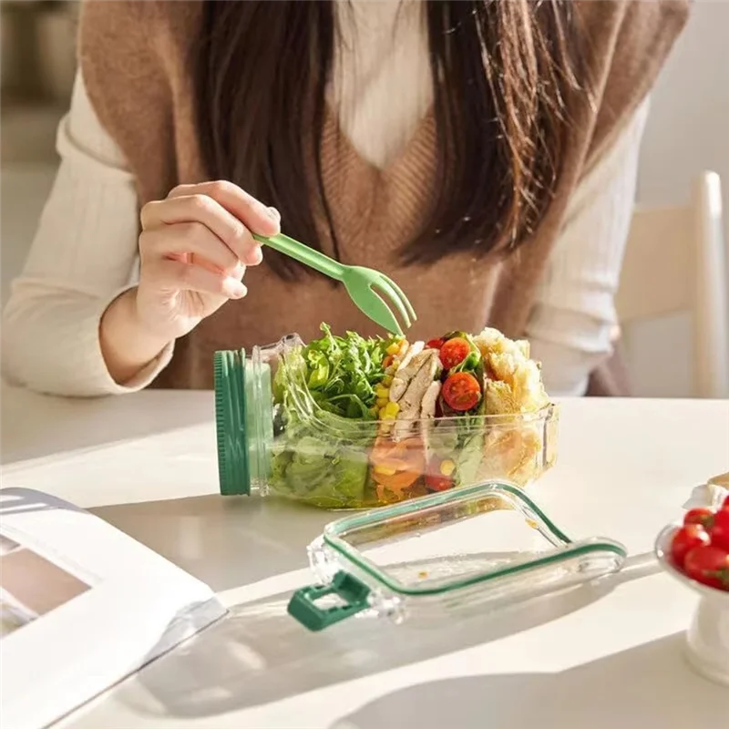 woman with spoon dig in salad jar
