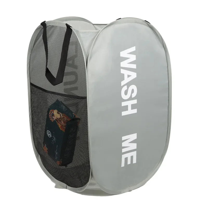 Gray laundry bag with black mesh pocket and 'WASH ME' text on a white background