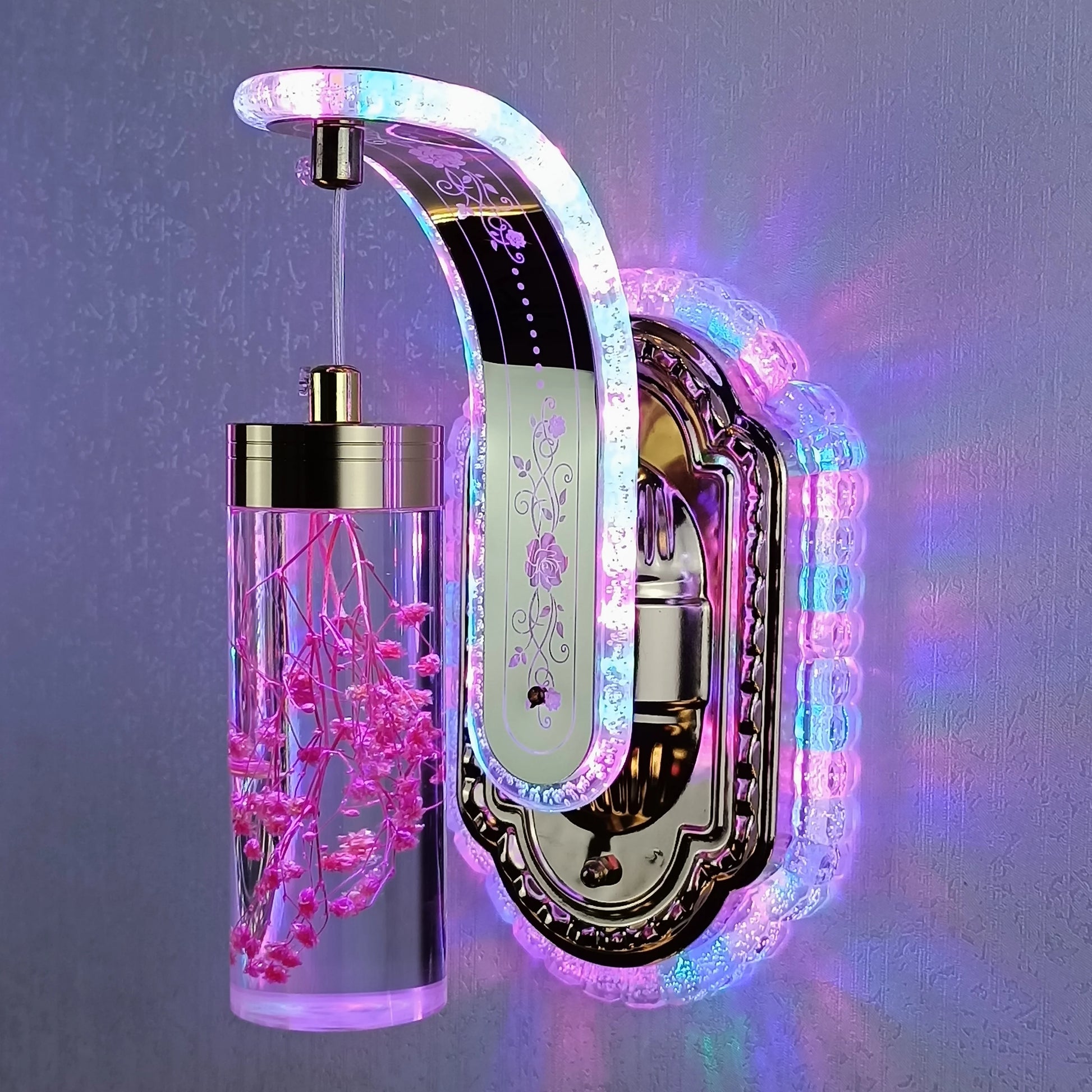 Decorative wall-mounted lamp with LED lighting and floral arrangement on a gray background