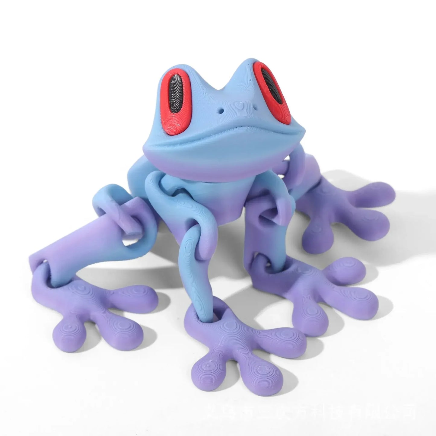 Blue and purple frog-shaped toy on a white background