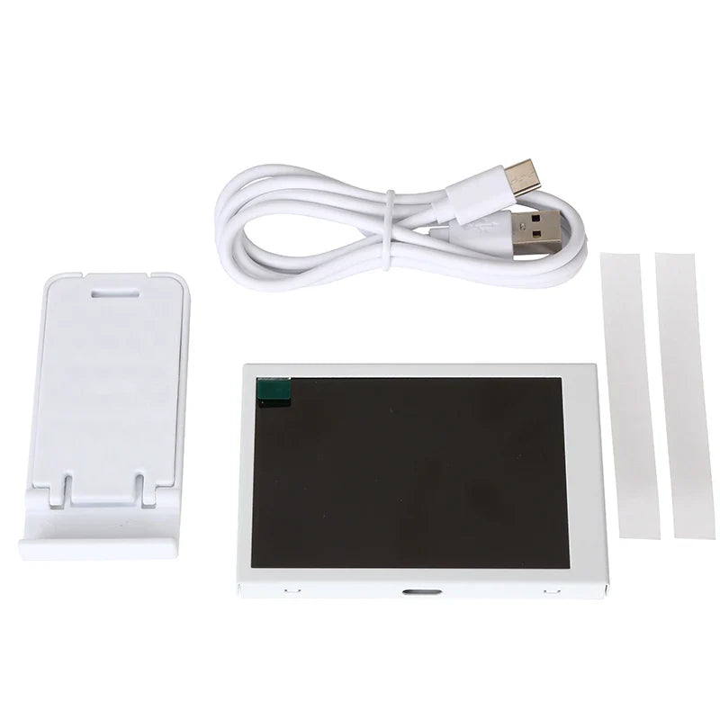 Electronic components including a screen, cable, and small device on a white background