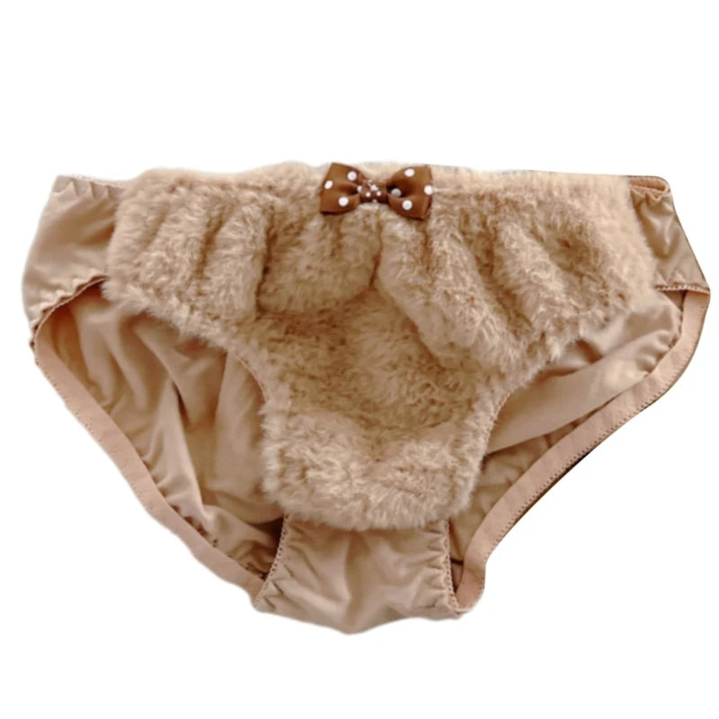 Beige baby bloomers with fluffy texture and a bow on a white background