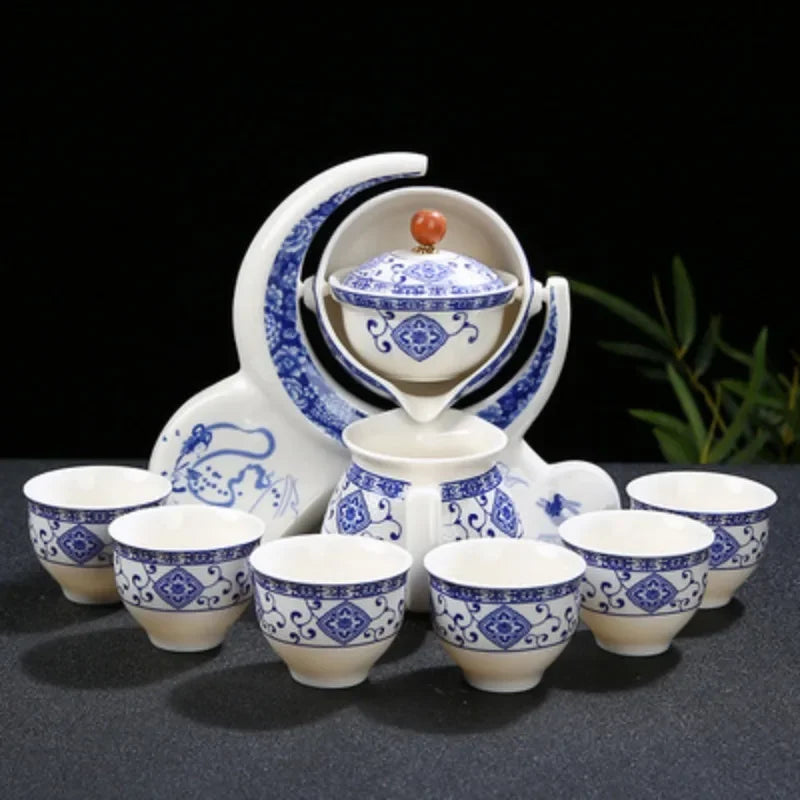 Ceramic tea set with blue and white patterns on a black background