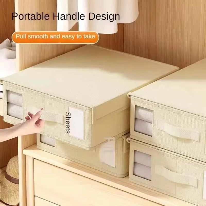 Beige storage bins with clear panels labeled 'Sheets' on a wooden shelf.