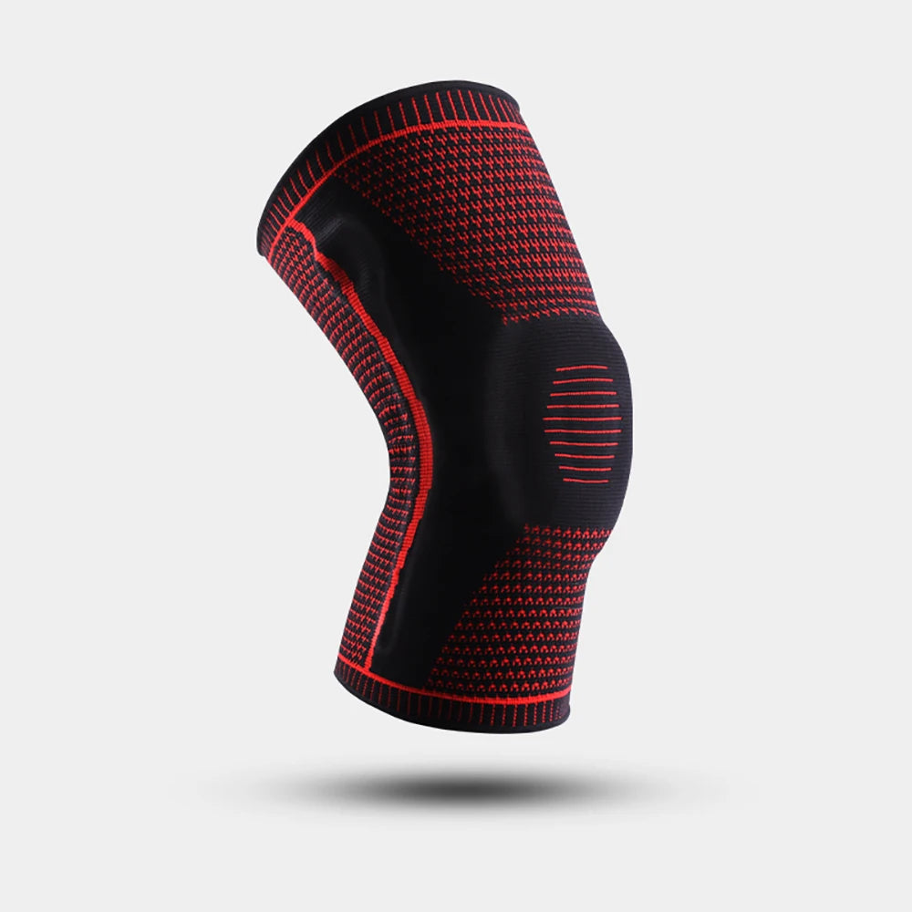 Black knee brace with red accents on a light gray background