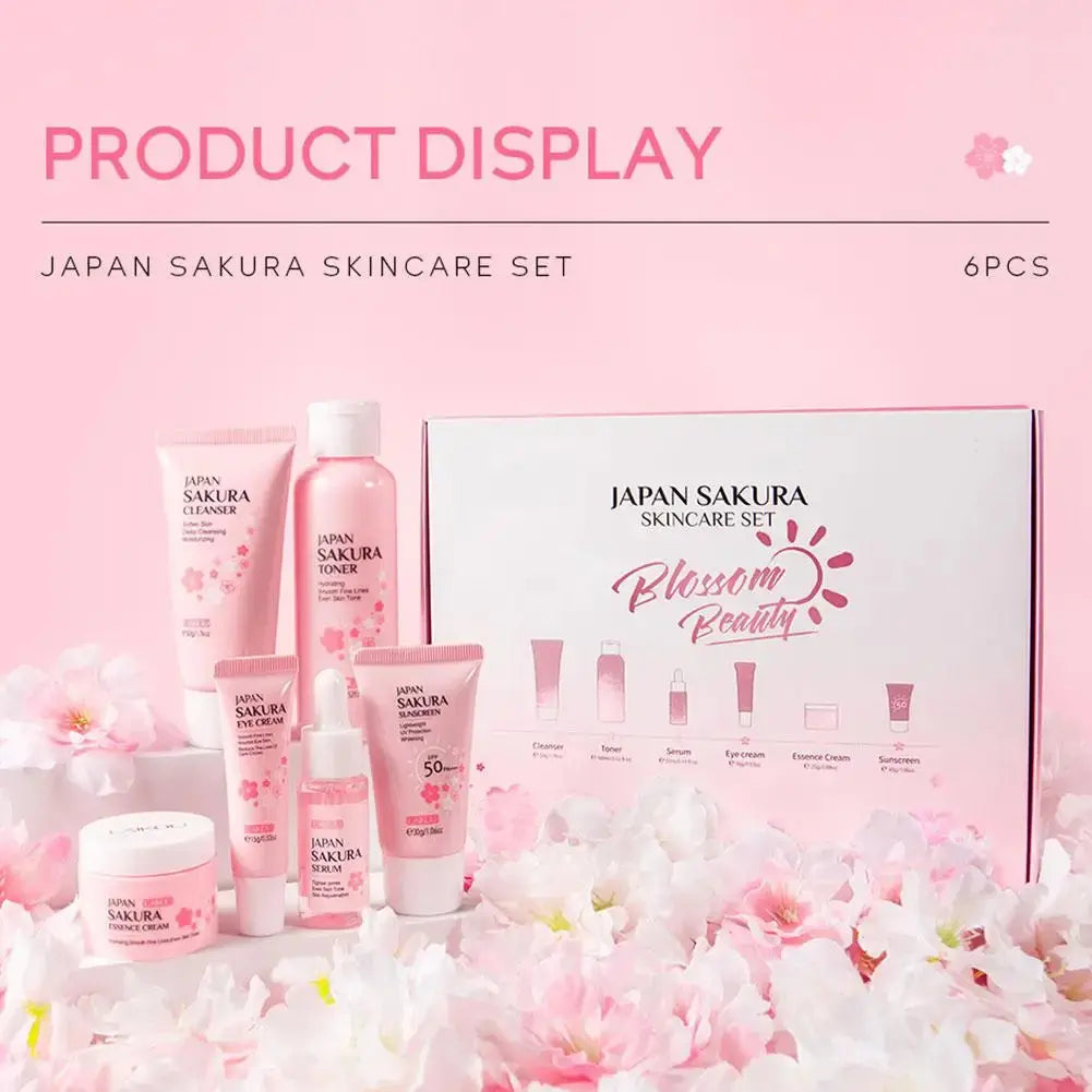 Japan Sakura skincare set with products and packaging on a pink background with cherry blossoms.