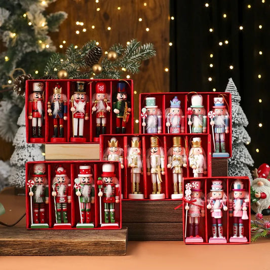 Set of nutcrackers in red display boxes with Christmas decorations in the background