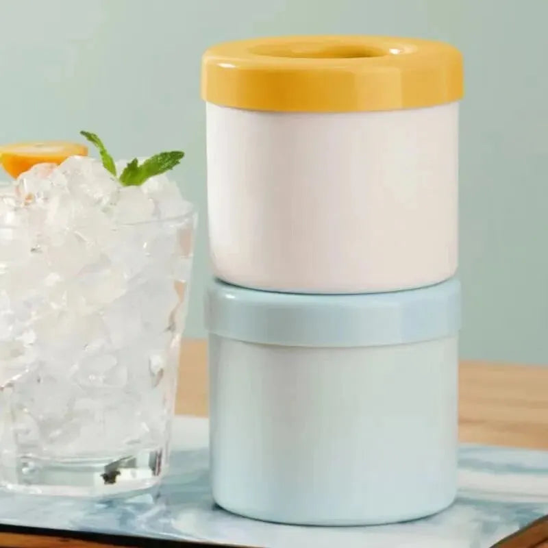 Two layered container with a yellow top and blue bottom on a light surface.