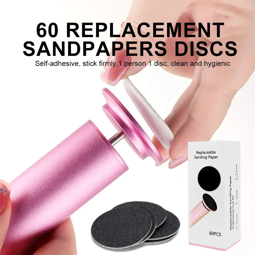 Pink sanding tool with replacement sandpaper discs and packaging on a white background