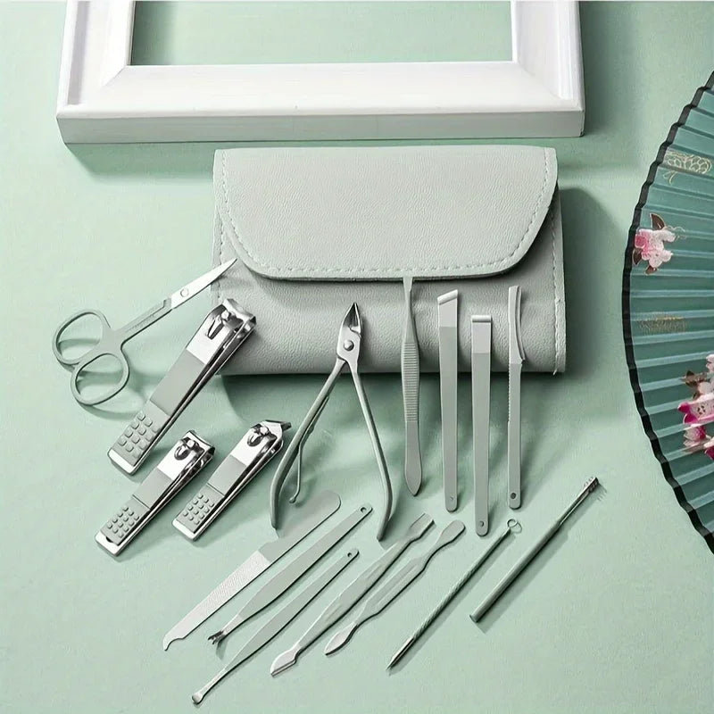 Set of metal manicure tools with a gray case on a light green background