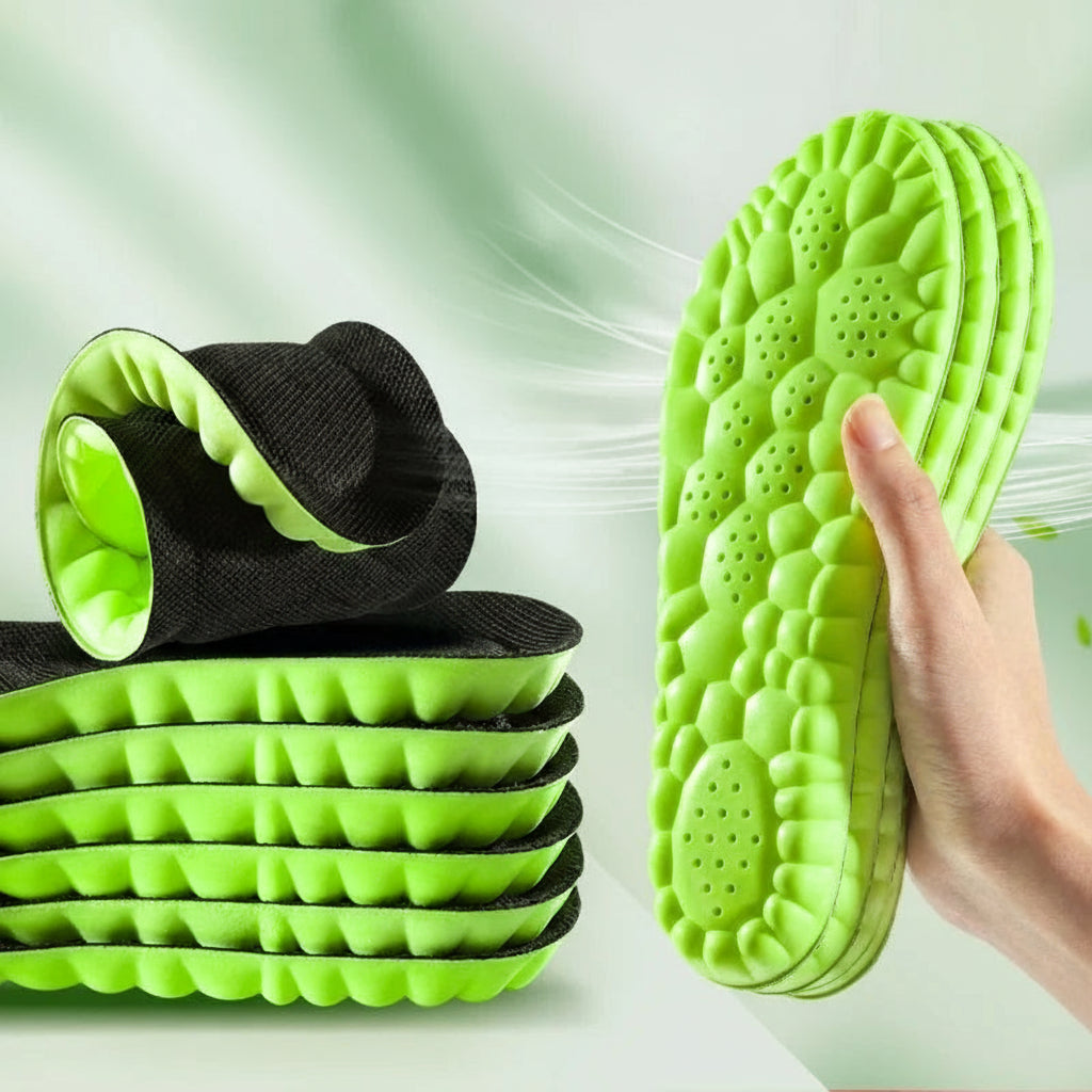 Green shoe inserts with black insoles on a white background, highlighting softness and comfort.