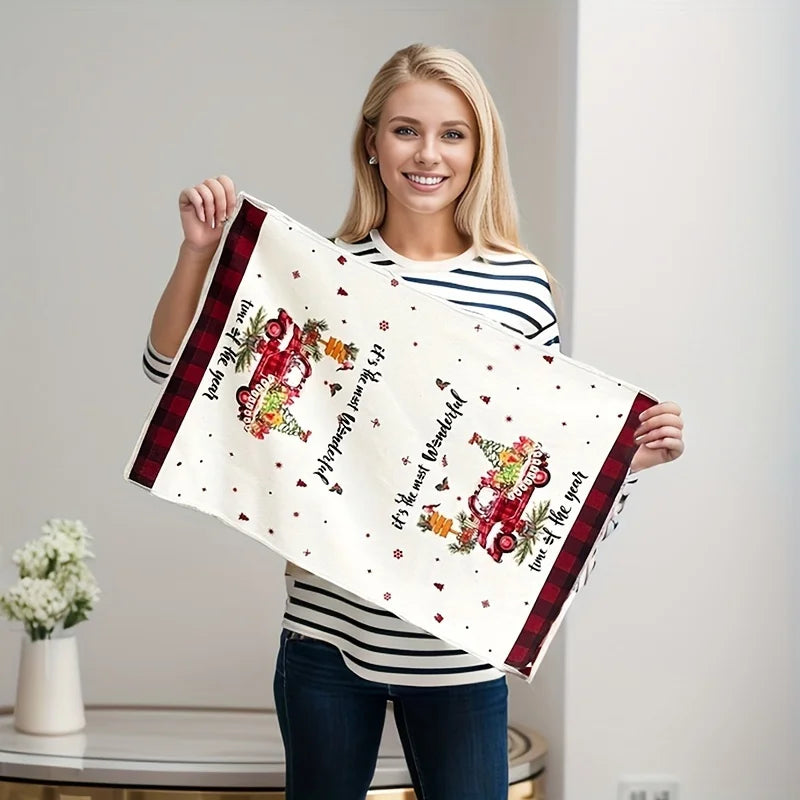 Woman holding a decorative towel with floral and text design