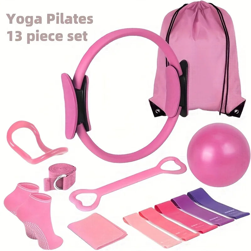 Pink yoga and Pilates equipment set with accessories on a white background