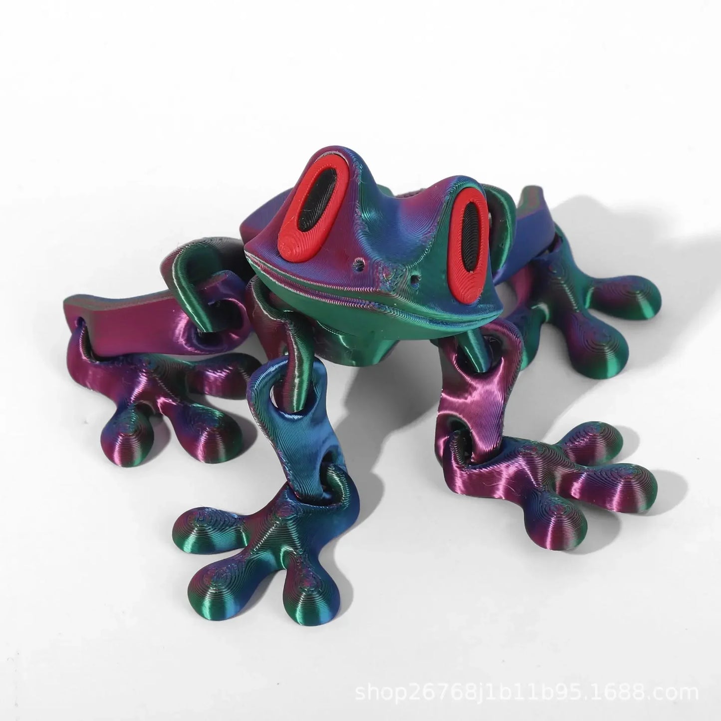 Colorful metallic frog sculpture on a white background