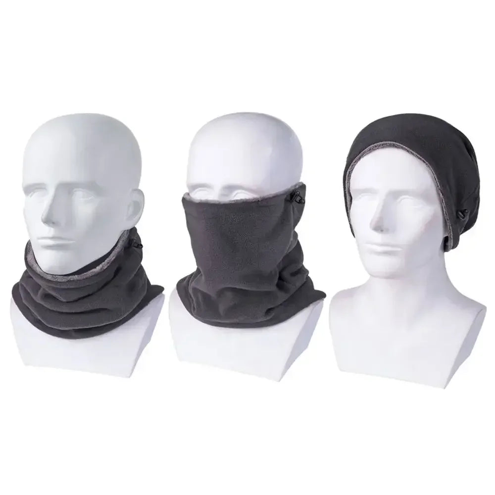 Three mannequin heads wearing gray neck gaiters and beanies on a white background