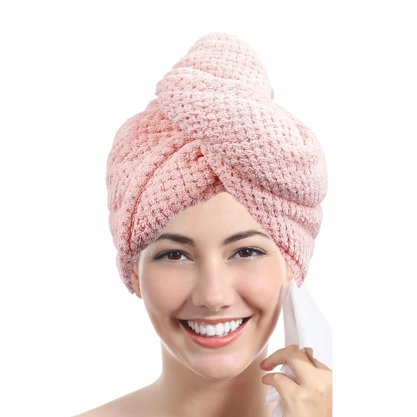 Woman wearing a pink towel on her head with a white background