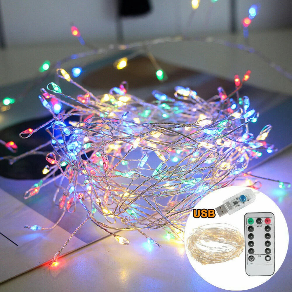 Multicolored string lights with USB power adapter and remote control on a surface.